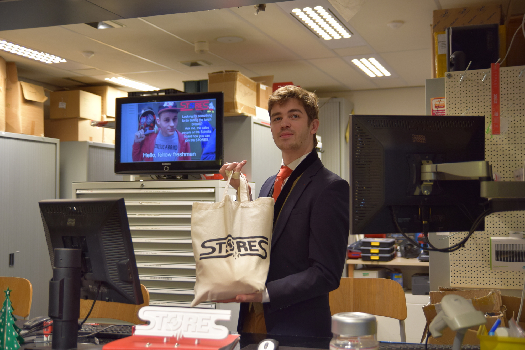 Figure 1: The administrator happily showing a STORES bag